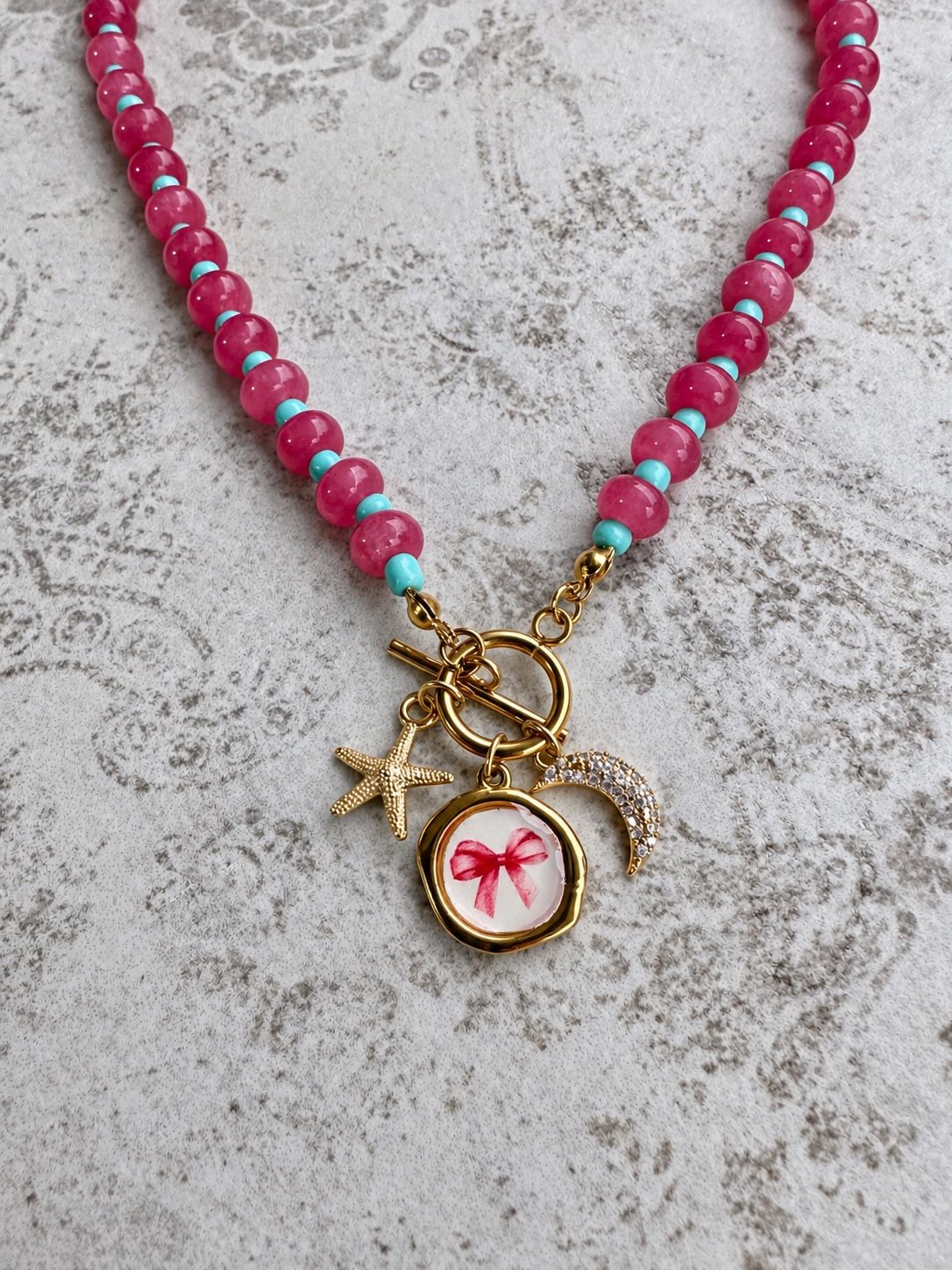 Collana rosa · Fiocco